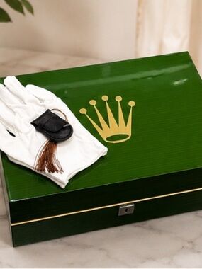 Rolex Green Box with Gold Crown and White Gloves
